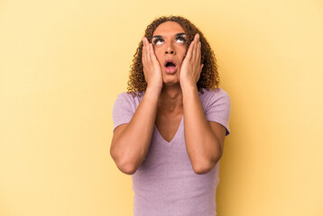 Young latin transsexual woman isolated on yellow background whining and crying disconsolately.