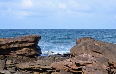 Fototapeta na wymiar View from the rocky coast to the turquoise sea
