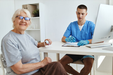 elderly woman patient sitting in the doctor's office professional consultation