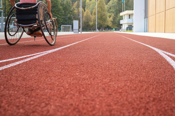 Athletic stadium track and a race wheelchair on it.