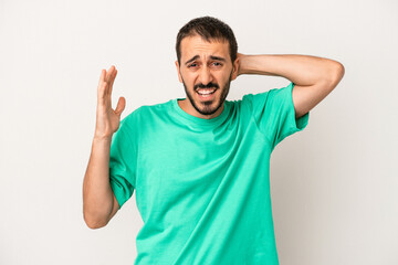 Young caucasian man isolated on white background screaming with rage.