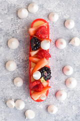 Eclair with fresh berries and meringue