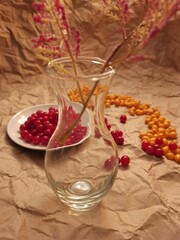 food, berries, yellow, red, glass, bouquet, vase, autumn, vegetable, garden, harvest, drink, compote, fruit juice, transparent, sea buckthorn, kalina, table, kitchen, dessert, diet, cottage, village, 