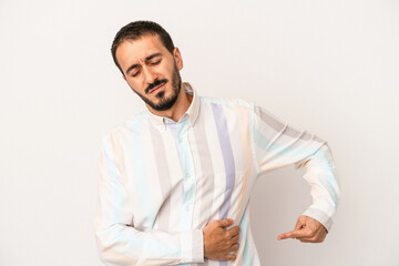Young caucasian man isolated on white background having a liver pain, stomach ache.