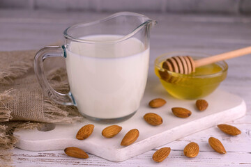 Almond milk in a small jug. Homemade almond milk.