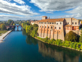 Aerial view of Adda river, with the castle of Cassano d'Adda town, Lombardy, Italy - obrazy, fototapety, plakaty