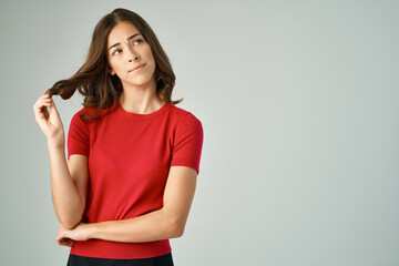 Obraz premium beautiful woman in a red t-shirt hair care Studio Lifestyle