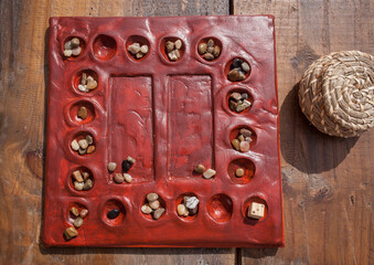 Reconstruction of roman board game Tabula Lusoria. Private recreational activity of ancient romans