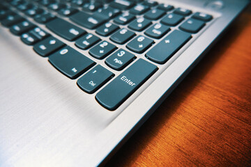 Modern laptop keyboard close up