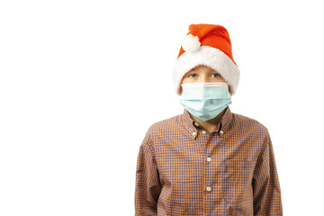 child in Santa Claus hat and medical mask isolated on white