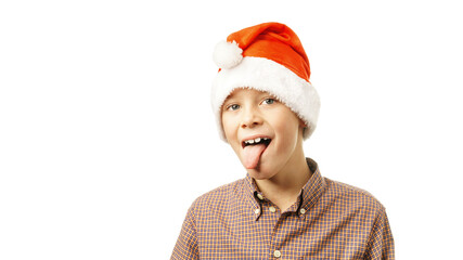 boy in santa hat shows tongue isolated on white background.