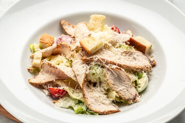 Homemade chicken salad with chicken breasts and fresh vegetables. Delicious breakfast or snack, Clean eating, dieting. Top view