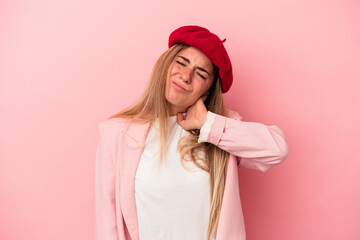 Young Russian woman isolated on pink background massaging elbow, suffering after a bad movement.