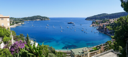 Naklejka premium Extra wide Aerial view of the beautiful beaches and the fantastic sea of Villefranche-sur-Mer