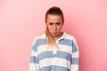 Young Russian woman isolated on pink background showing a dislike gesture, thumbs down....