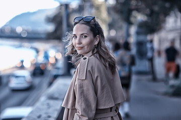 Fototapeta premium spring portrait of a girl with beautiful bokeh, happy beautiful woman on a walk