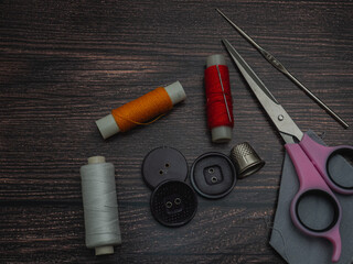 sewing accessories on dark background