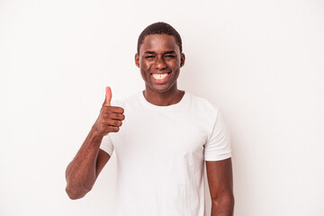 Young African American man isolated on white background smiling and raising thumb up