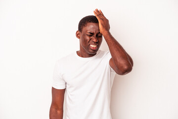 Young African American man isolated on white background forgetting something, slapping forehead with palm and closing eyes.