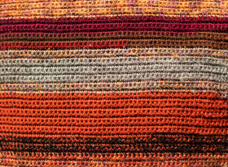 GreeGreen and orange background with checkered pattern, closeup. Structure of the fabric macro.n and orange background with checkered pattern, closeup. Structure of the fabric macro.