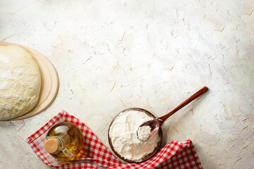 Preparation pizza dough, olive oil with copy space. Yeast dough made from white wheat flour. Homemade bread