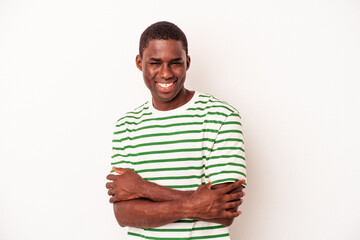 Young African American man isolated on white background who feels confident, crossing arms with determination.