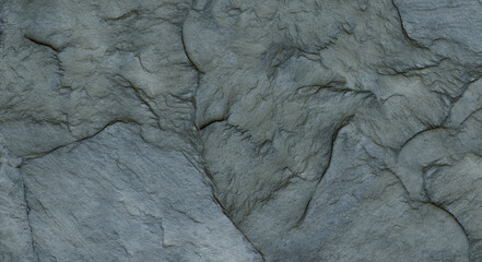 Fototapeta premium The texture of the stone wall. Close-up. Light gray rock backdrop.