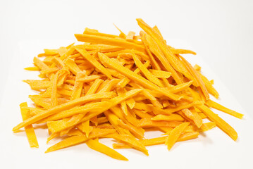 Dry tasty mango slices as a background.