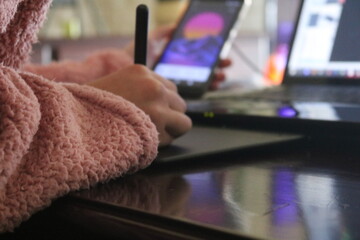 person using a tablet computer