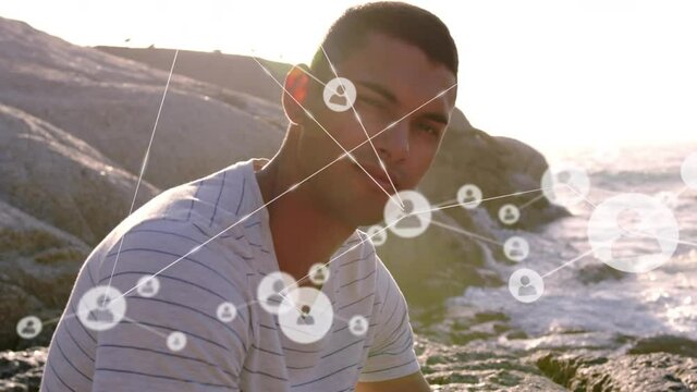 Animation of network of connections over man on the beach