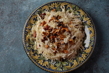 Cranberry and walnuts Coleslaw salad on a plate. Mediterranean salad. Israeli food