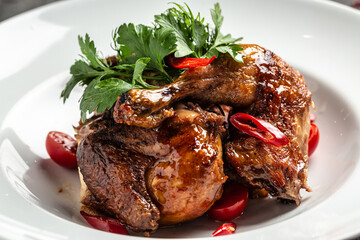 quarter chicken leg baked with tamarind sauce and with chili peppers and herbs, Food recipe background. Close up