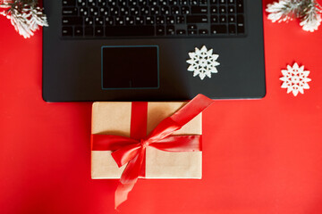 Christmas shopping online concept, Laptop with green screen placed on table with presents Christmas decorated , Table Top view of the desk with laptop, present boxes