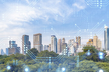 Technology hologram over panorama city view of Bangkok. The largest tech hub in Southeast Asia. The concept of developing coding and high-tech science. Double exposure.