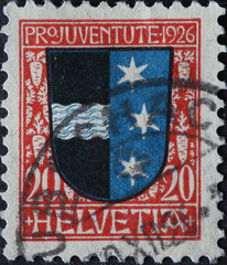 Switzerland - Circa 1926: a postage stamp printed in the Switzerland showing a star against a mild...