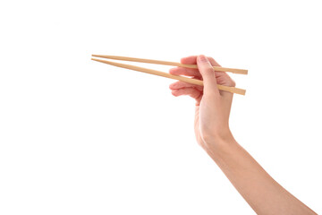 female hand holds Wooden chopsticks isolated on white background.