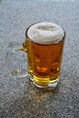 A glass of Dutch blond beer on the table