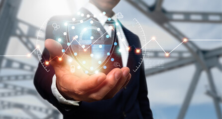 Cyber security and data protection. A businessman uses a virtual network connection to protect commercial and financial data with a padlock. Ingenious solutions are created by innovative technologies