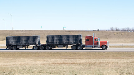 Heavy Cargo on the Road. A truck hauling freight along a highway