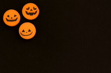 Three variants of the Jack-o-lantern on a black background. The Halloween symbol. Orange and black colors, minimalism.