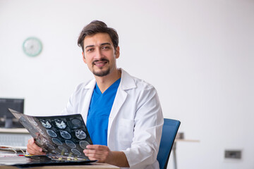 Young male doctor radiologist working in the clinic