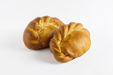 Pies with pinches in the form of pigtails on a light background