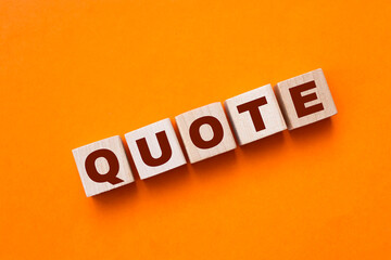 Quotes - word from wooden blocks with letters, citation official notice or quotation concept