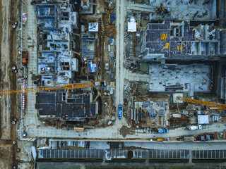 Construction work on the site, aerial view from top down of new appartment block.
