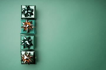 Merry Christmas and Happy New Year. Christmas, winter, new year concept. Holiday gifts. Greeting card, banner with place for text. Christmas gifts. Winter holiday xmas theme.Christmas green background