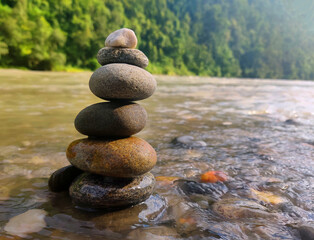 stack of stones on the river. The concept of harmony and balance. Stone Balancing.