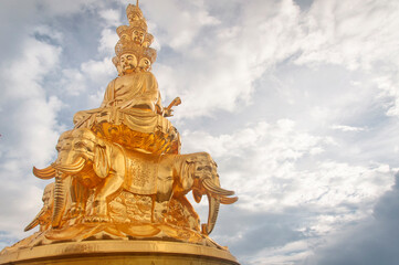 Fototapeta premium gold statue of Samantabhadra Bodhisattva mount emei summit