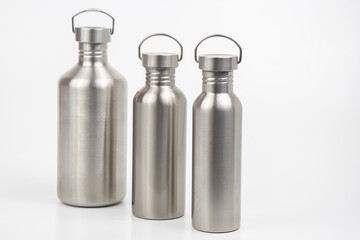 metal steel water flasks on white background. metal drinking utensils