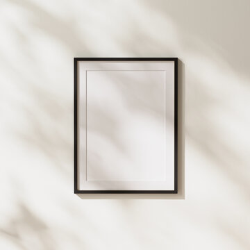 Empty Black Vertical Poster Frame With Mat Mock Up With Leaves Shadows And Sunlight On White Wall Background, 3d Rendering