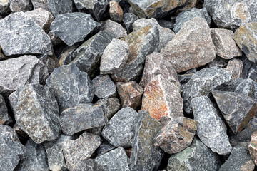Perfect gray background for design from a variety of large stones, top view